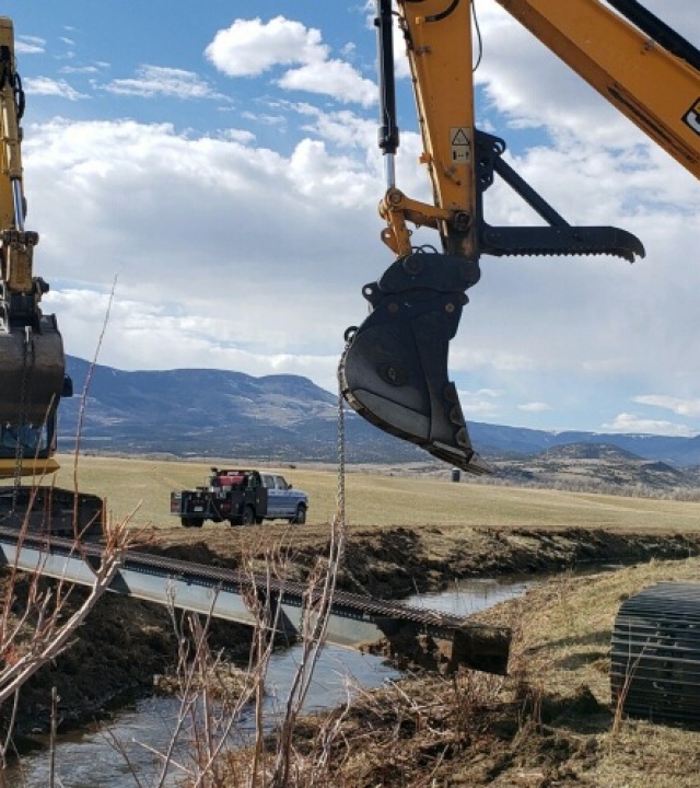 Ditch excavation and setting bridges for new pivot sprinkler